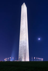 Low angle view of monument against sky at night