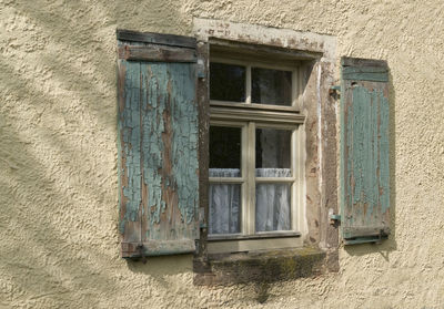 Low angle view of window of old building