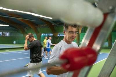 Man at tennis court