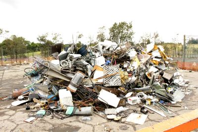 Stack of garbage by metal structure