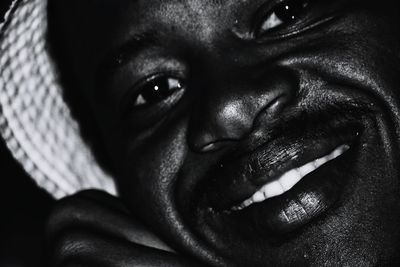 Close-up portrait of smiling man at home