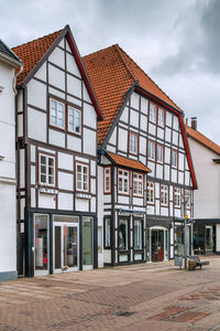 Street with historical half-timbered houses in the old city of paderborn, germany