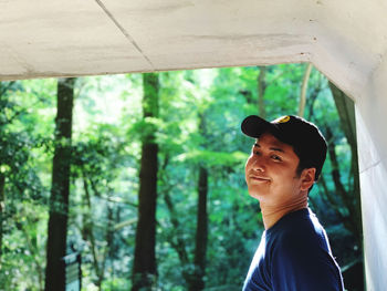 Portrait of young man in forest
