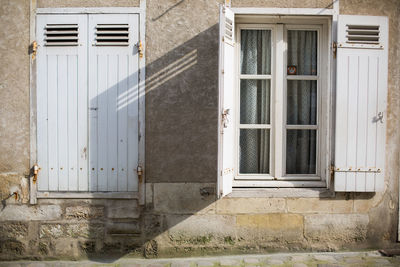 Open window shutter of old house