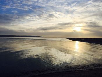 Scenic view of sea against sky at sunset