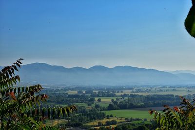 Scenic view of mountains against cloudy sky