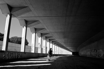 Rear view of young man with skateboard