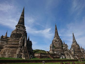 Low angle view of old temple building against sky