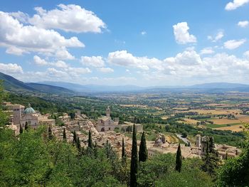 Aerial view of landscape against cloudy sky