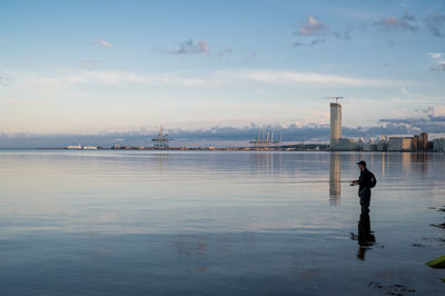 Fisher in front of resindential area aarhus Ø