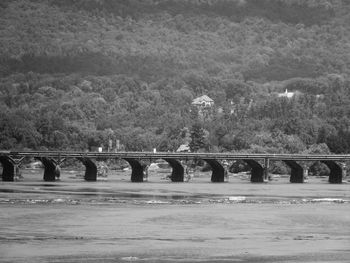 Rockville bridge over susquehanna river against tree mountain