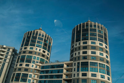 Low angle view of skyscrapers against sky