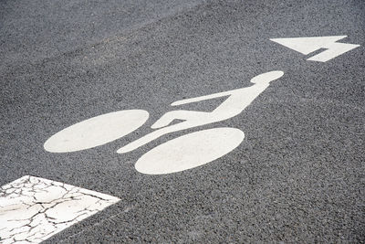 High angle view of arrow sign on road