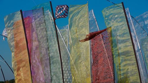 Low angle view of flag against sky