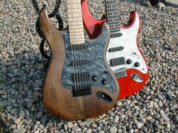 High angle view of guitar on stones