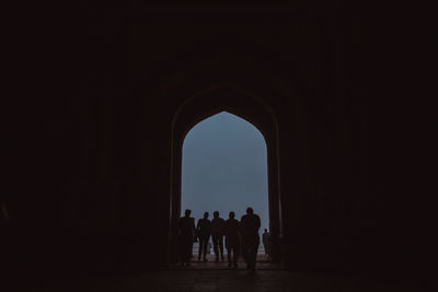 Silhouette of people against clear sky