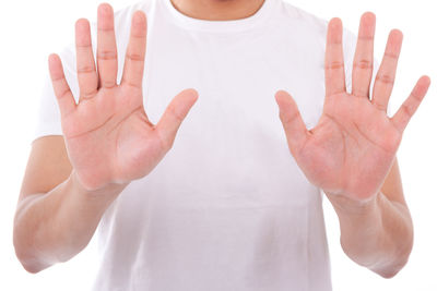 Close-up of human hand against white background