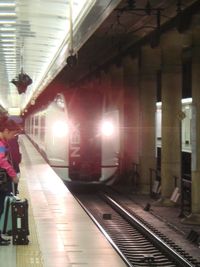 Man in illuminated subway station