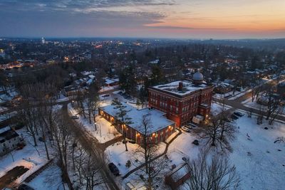 Drone photo of building in winter at dusk