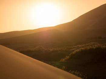 Scenic view of landscape against sky during sunset