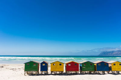 Beach huts against blue sky