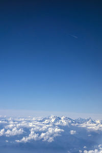 Scenic view of clouds over mountain