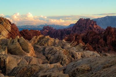Rock formations on landscape against sky