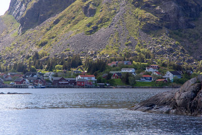 Scenic view of river amidst buildings