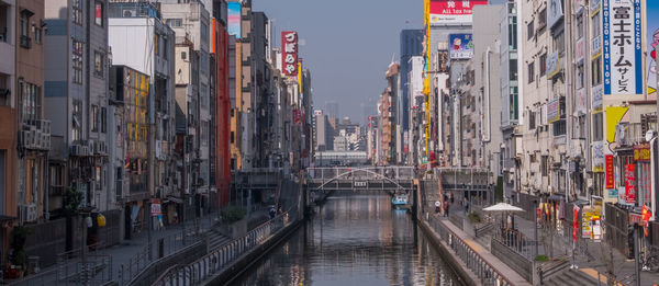 Panoramic view of street amidst buildings in city