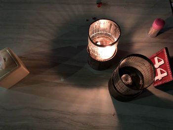 High angle view of illuminated lantern on table