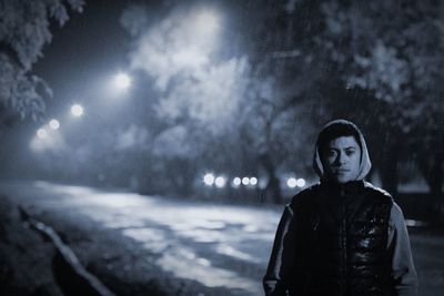 Portrait of woman standing in snow