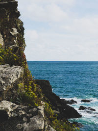 Scenic view of sea against cloudy sky