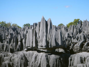 Panoramic view of rock formations against sky