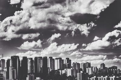 Cityscape against cloudy sky