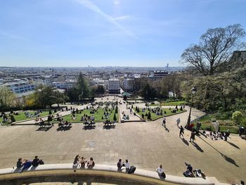 High angle view of people in city against sky