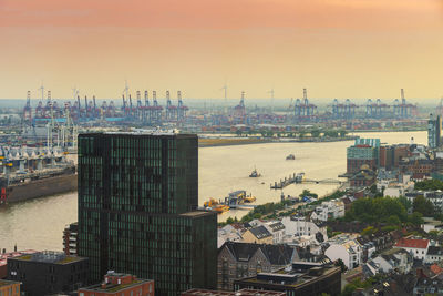 High angle view of commercial dock against buildings in city