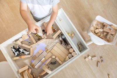 High angle view of woman standing on table