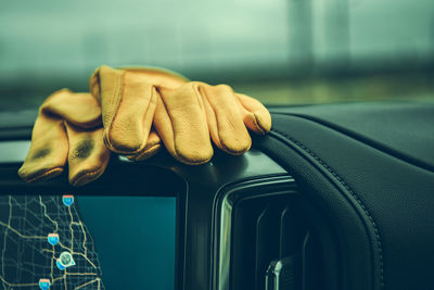 Cropped hand of woman using mobile phone