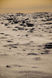 Scenic view of beach against sky during sunset