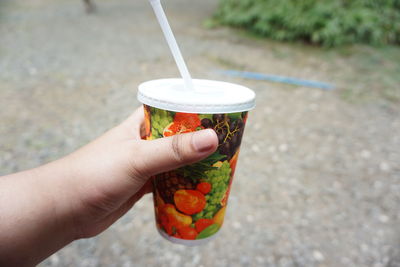 Midsection of person holding ice cream