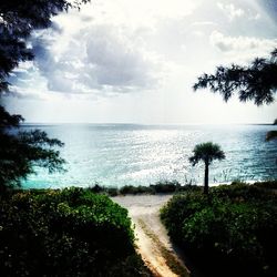 Scenic view of sea against cloudy sky