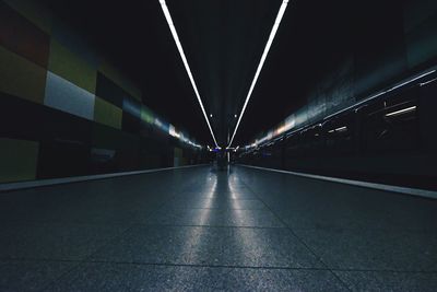 Man in illuminated city at night