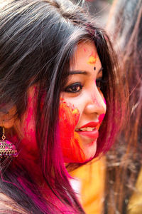 Close-up of woman with face paint during holi