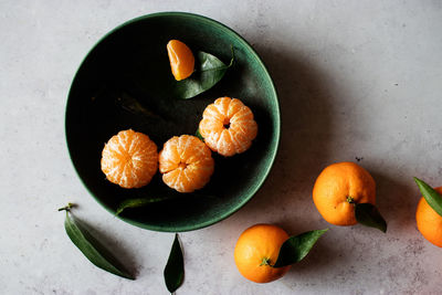 High angle view of orange fruits on table