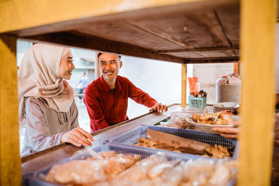 Man preparing food at market