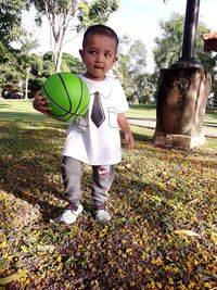 Portrait of boy standing outdoors