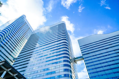 Low angle view of modern buildings against sky