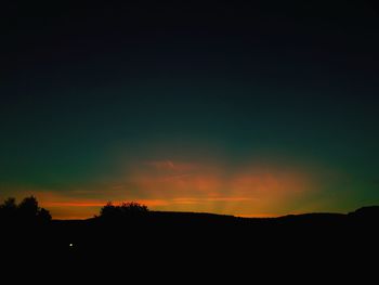 Scenic view of silhouette landscape against sky during sunset