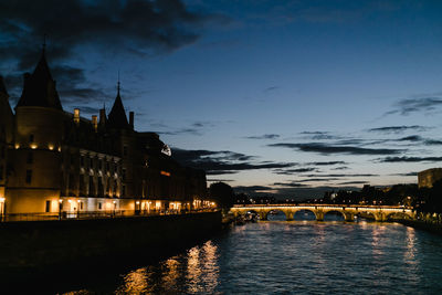 Illuminated city at waterfront