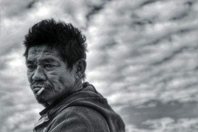 Portrait of man looking away outdoors